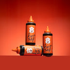 Three bottles of 'hot sap' on an orange background